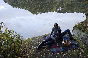 Mind Body Soul - Young couple picnicking lakeside