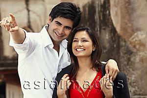 Asia Images Group - man pointing out something to woman