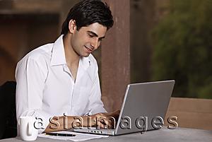 Asia Images Group - man working at laptop computer
