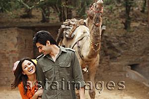 Asia Images Group - couple in front of camel