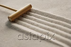AsiaPix - closeup of zen sand garden with rake