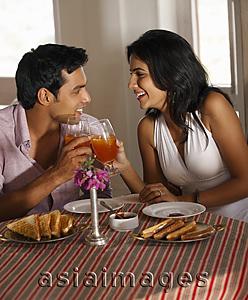 Asia Images Group - couple at restaurant, toasting