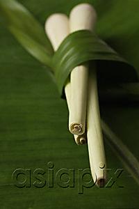 AsiaPix - lemon grass stalks placed on top of banana leaf