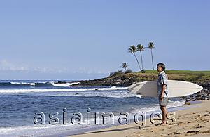 Asia Images Group - mature man holding surf board