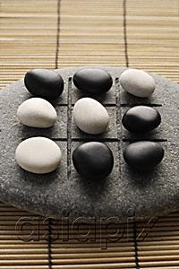 AsiaPix - black and white pebbles on zen stone