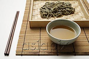 AsiaPix - cooked soba noodles with sauce on bamboo tray and chopstick setting