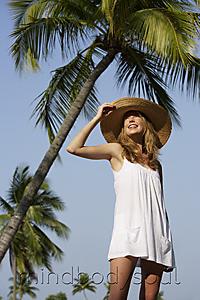 Mind Body Soul - Woman standing under palm trees
