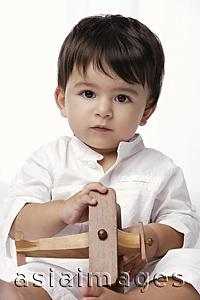 Asia Images Group - baby boy holding toy airplane