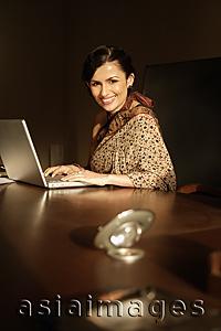 Asia Images Group - woman in sari on laptop