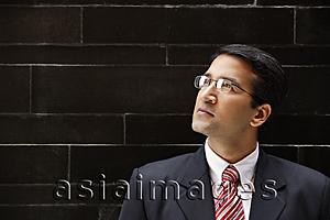 Asia Images Group - businessman in suit, glasses