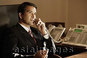 Asia Images Group - businessman on phone, in office