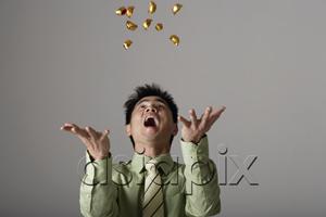 AsiaPix - man throwing gold into the air