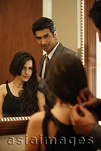Asia Images Group - couple looking into mirror
