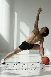 AsiaPix - man working out with medicine ball