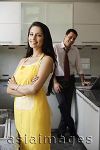 Asia Images Group - young couple posing for camera in kitchen