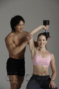 AsiaPix - man and woman with free weight