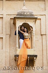 Asia Images Group - young couple posing on balcony