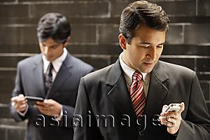 Asia Images Group - businessmen with mobile devices