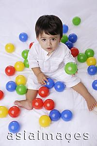 Asia Images Group - baby boy playing with balls