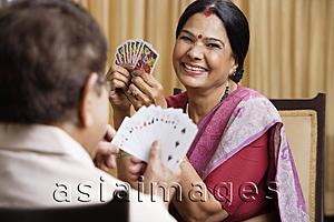 Asia Images Group - couple playing cards