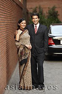 Asia Images Group - couple in front of car, woman in sari