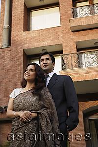 Asia Images Group - couple standing in front of home