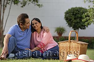 Asia Images Group - couple having picnic