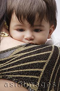 Asia Images Group - woman holding baby