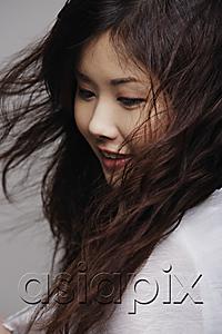 AsiaPix - Head shot of Chinese woman with long hair