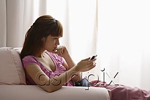 AsiaPix - Asian girl reading a text message