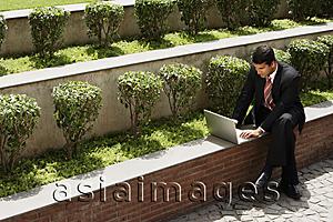 Asia Images Group - businessman working outside, laptop computer