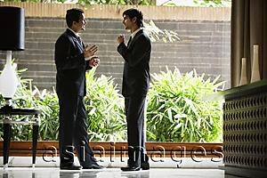 Asia Images Group - businessmen in hotel lobby