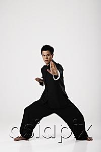 AsiaPix - Man doing martial arts wearing traditional Chinese clothes
