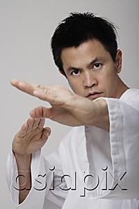 AsiaPix - Close up of man using martial arts