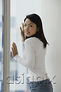 AsiaPix - Young Asian woman looking out window