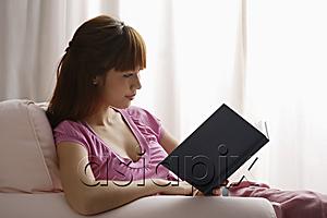 AsiaPix - Asian girl reading book by window