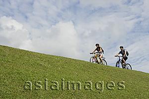 Asia Images Group - Two people riding bicycles