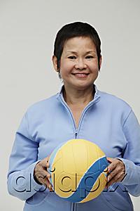 AsiaPix - Mature Chinese woman holding a volleyball