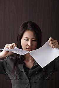 AsiaPix - woman ripping paper