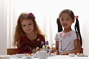 AsiaPix - two young girls playing together
