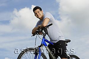 Asia Images Group - Man on bicycle