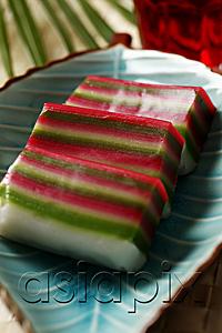 AsiaPix - Nine layer cake (Kueh) on a plate. Traditional Malay dessert.