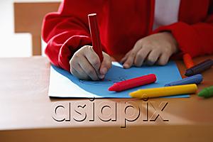AsiaPix - cropped shot of young girl coloring with crayons