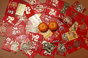 AsiaPix - Man different Hong Baos, red envelopes with oranges.