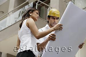 Asia Images Group - contractor or architect with blueprints