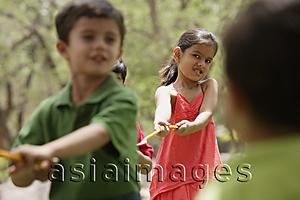Asia Images Group - kids playing tug-o-war