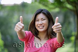 Asia Images Group - Young woman making 