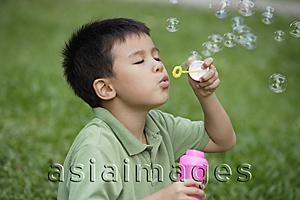 Asia Images Group - Boy blowing bubbles