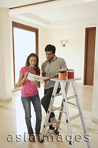 Asia Images Group - Young couple with paint supplies
