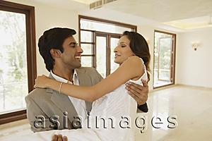 Asia Images Group - Young couple in empty home